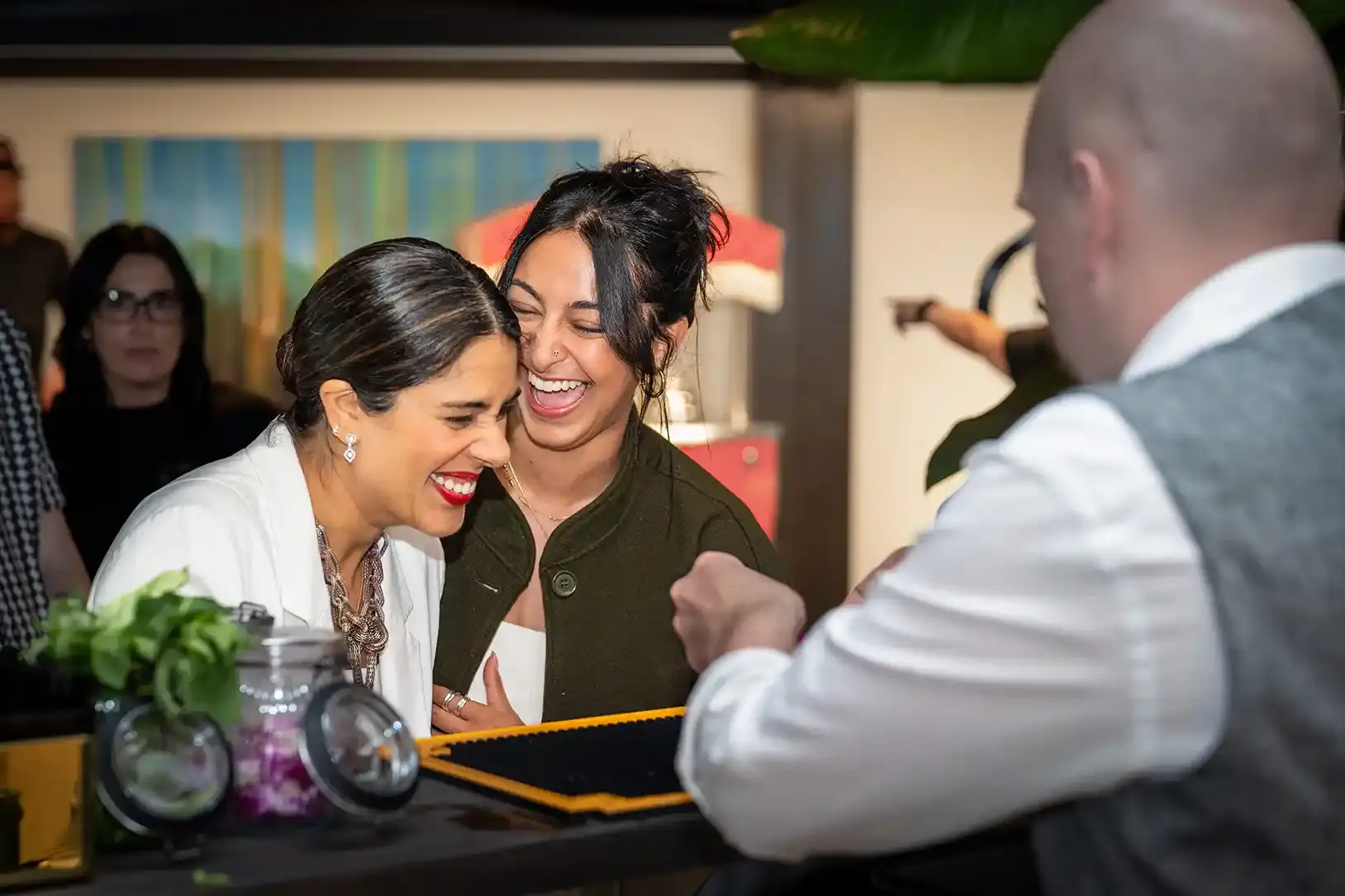 Laughing guests being served at a Tipsy Tiger bar