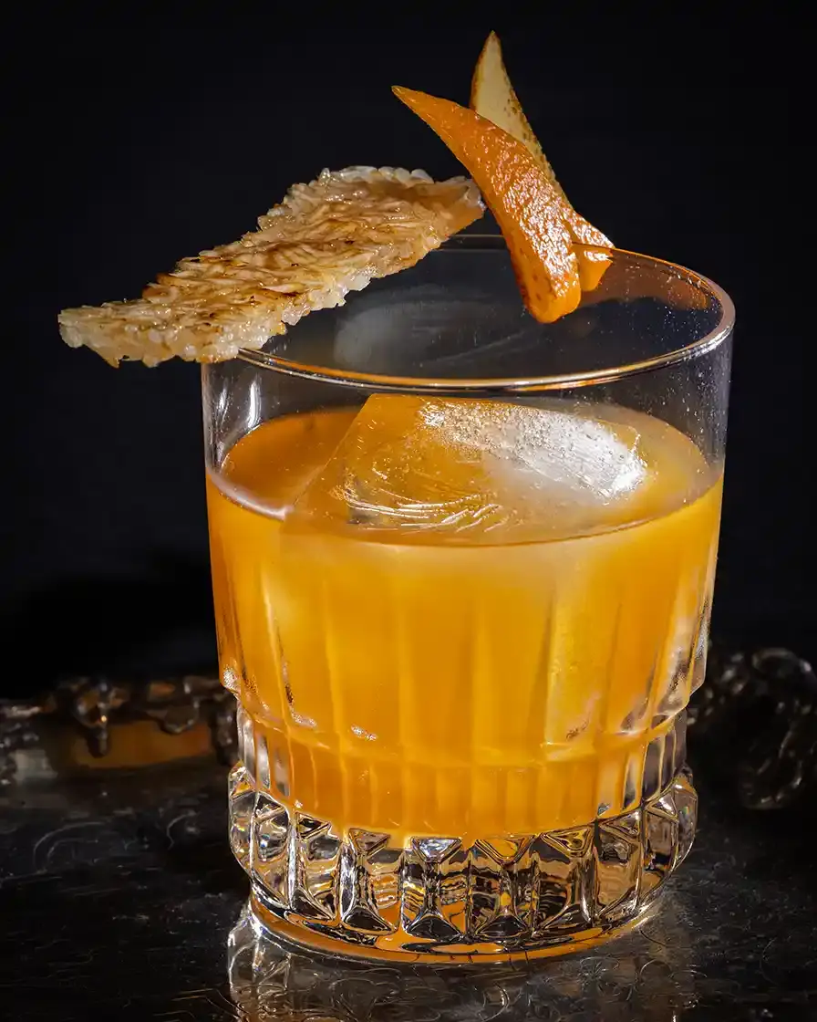 A picture of a Tipsy Tiger signature cocktail, the Nurungji Old Fashioned
