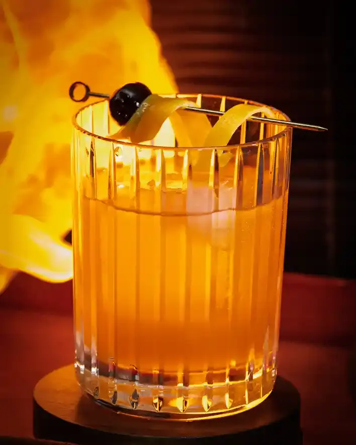 A picture of a Tipsy Tiger signature cocktail, the Snake Oil